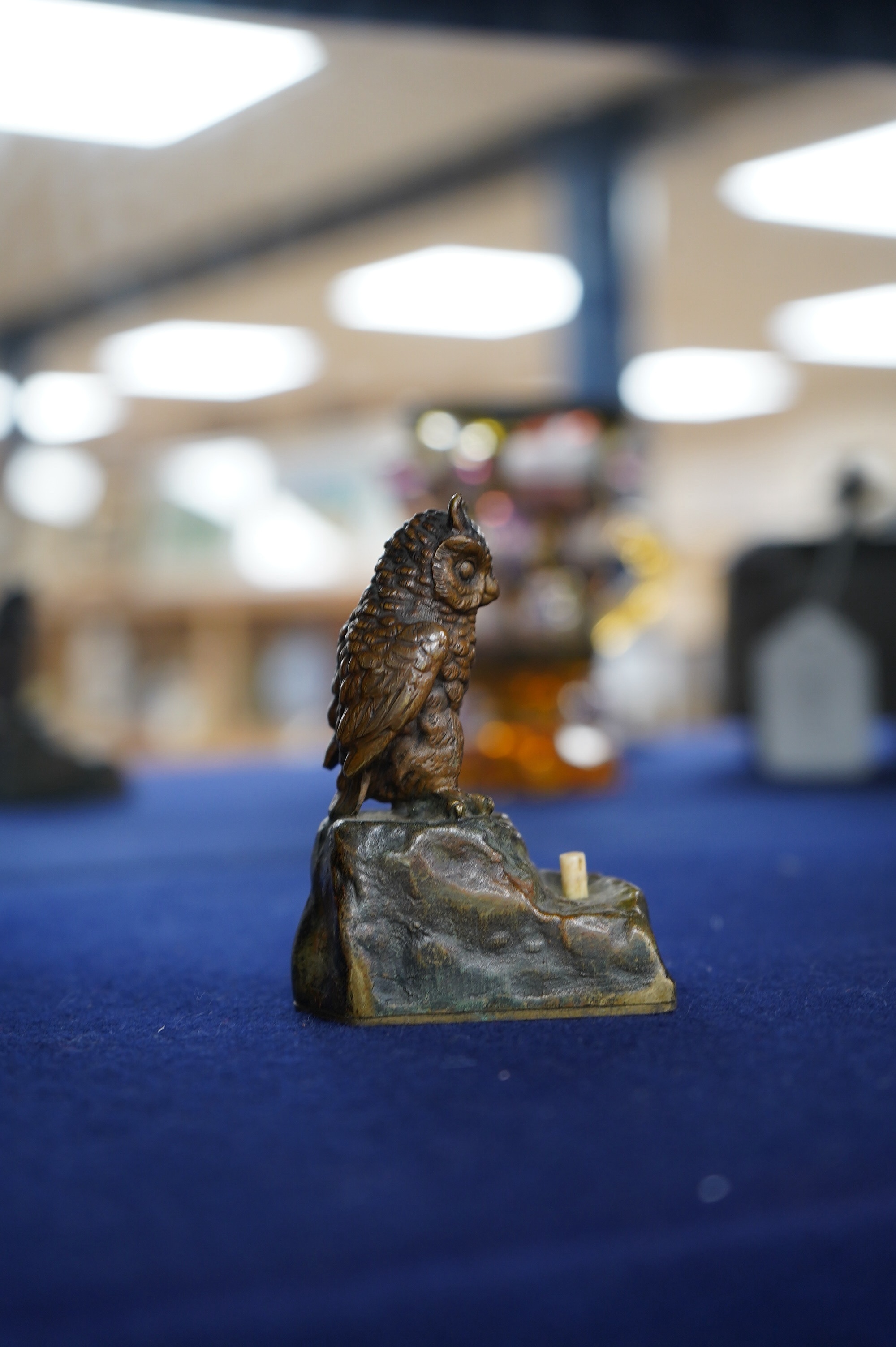 An Austrian cold painted bronze bellpush modelled as a perched owl, 7.5cm high. Condition - fair.